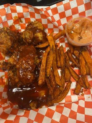 Tenders with bbq sauce, sweet potato fries and Cane's dipping sauce