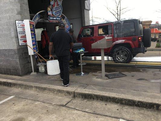 Employee and District Manager instructing me to back out of car wash