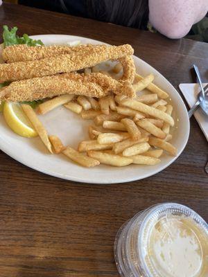 Tiny pieces of fish with tiny burnt up french fries