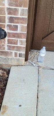 Garage built too small so they cut the brick and scabbed on concrete to both sided to make the driveway wider.