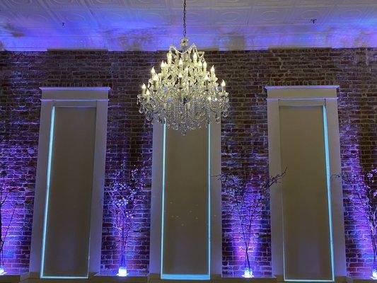 Beautiful uplighting and chandelier.