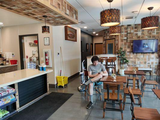 Counter and seating area. Bathrooms in the back on the left. Conference/meeting room in the back right