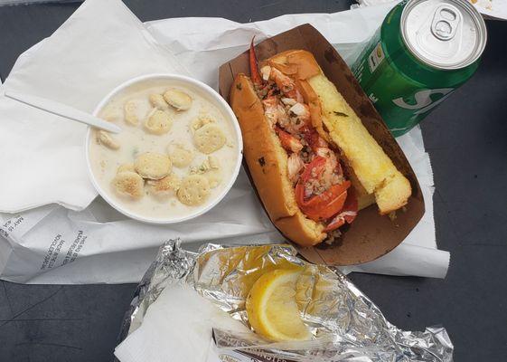 the hot butter lobster roll combo includes a drink and clam chowder.  $35 with tax.