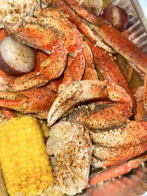 Wednesday special buy 1lb get a pound 50% off snow crabs and Dungeness crab with signature sauce corn and potato