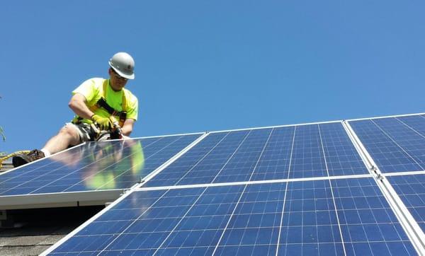 Dave putting the finishing touch on a solar array.