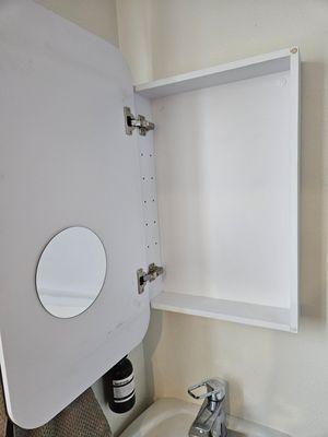 Hanging medicine cabinet mounted for a client