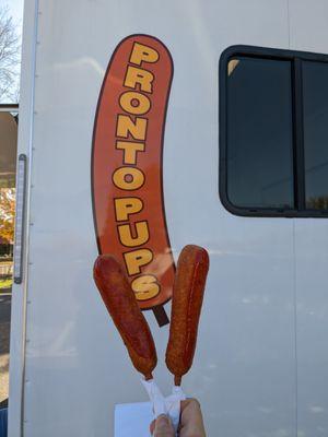 Two Pronto Pups with ketchup brushed on them