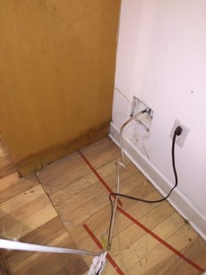 Water damage behind the refrigerator & in the kitchen. What did Equity do about it? Nothing.