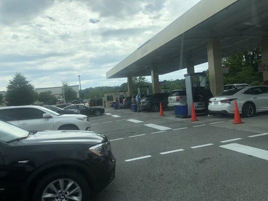 Cars lined up at the pump