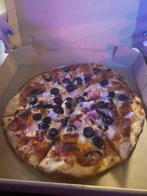 Make your own pizza with olives, red onions and bacon.