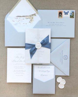 Custom soft blue wedding invitations with letterpress printing and Pismo Beach liner