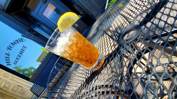 MILL TOWNE GOURMET RESTAURANT exterior table with ice tea in Griffin, GA.