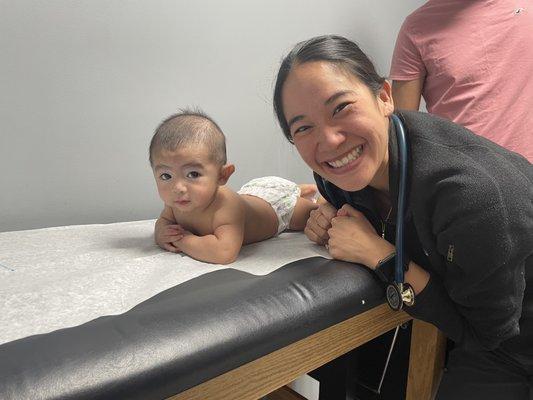 Zayden showing Dr Lin tummy time