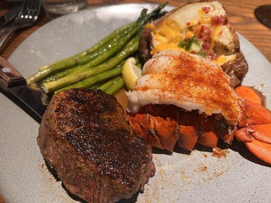 Filet mignon & lobster with loaded potato and asparagus.