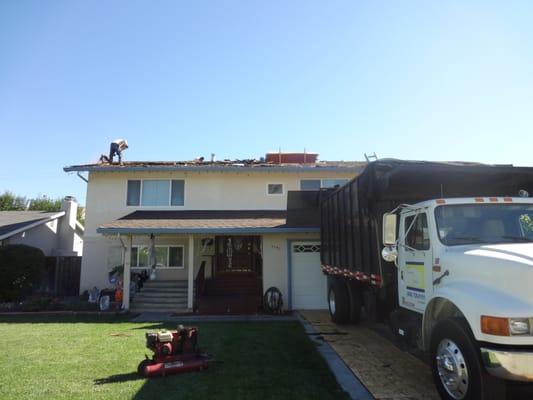 Demolition on first day, they put down plywood to protect driveway just in case as truck is heavy