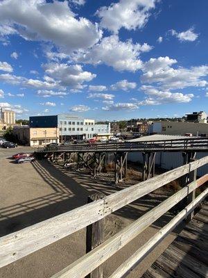 If you're walking from north of the river, this super cool bridge goes right to their doorstep. That blue building is them!