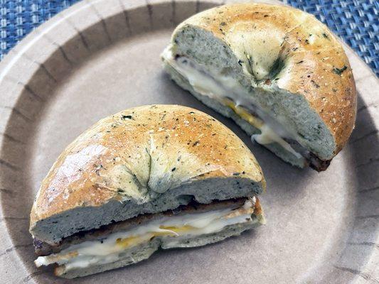 Sausage, egg, and cheese on a spinach bagel.