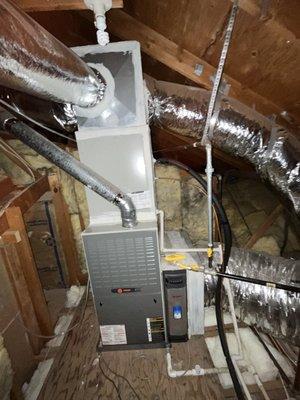 Attic mounted central heating and AC