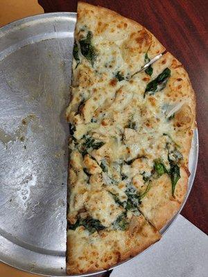 My custom Chicken Alfredo Pizza.  Alfredo sauce,  chicken,  spinach, onions, and mozzarella cheese.  Yum.