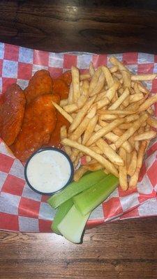 Buffalo chicken tenders with French fries .