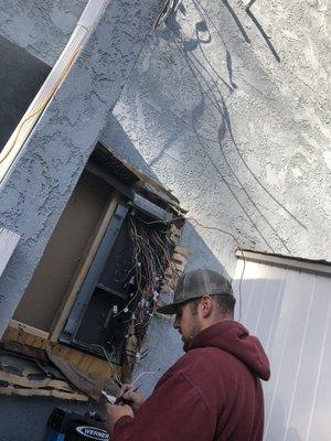 Benny the Forman in the process of upgrading the main electrical panel.