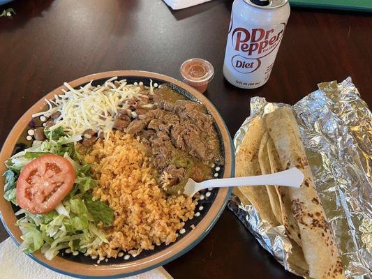 Chili verde, rice salad, cheese on fresh beans. Tortillas, soda and salsa