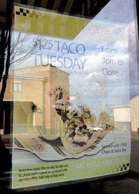 Prominent Taco Tuesday poster in the window.