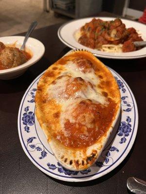 Stuffed shells, meatballs and spaghetti with sauce.