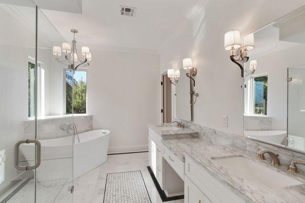 Marble tops & floor inlays, soaker tub overlooking large yard, 2 toned finishes, walk-in shower.