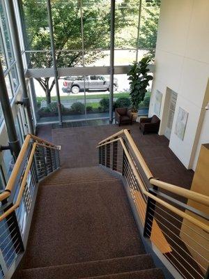 Down the stairs back to parking lot or there are exits on 2nd floor too