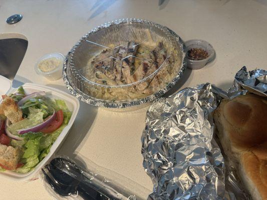 Fettuccine Alfredo with chicken, house salad & bread