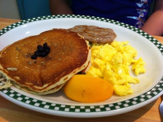 Eggs, sausage, and blueberry pancakes.