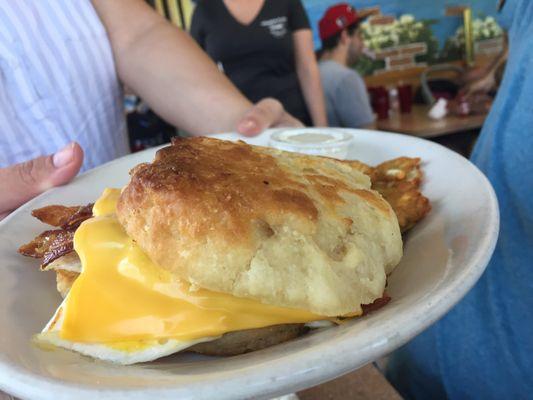 Breakfast biscuit sandwich with potato pancakes. Yum!! Biscuits made fresh each day!!