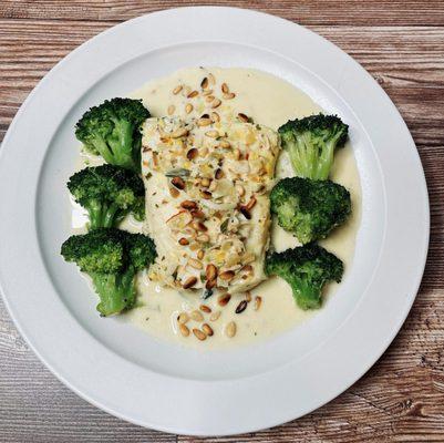 Coconut milk poached halibut with holy trinity veggies and pine nuts. Served with butter glazed broccoli.