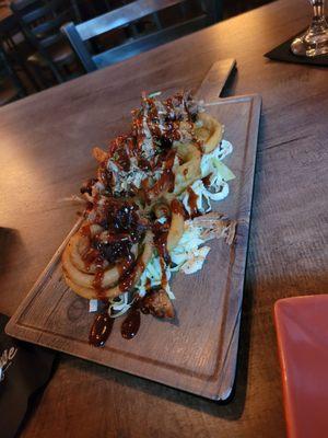 Smoked Pulled pork on onion rings with Cole slaw underneath-- great appetizer!