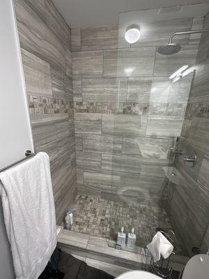 Frameless, glass shower, splash guard with chrome hardware