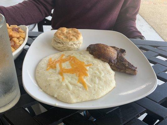 Legacy Breakfast with grilled pork chop, biscuit and cheese grits