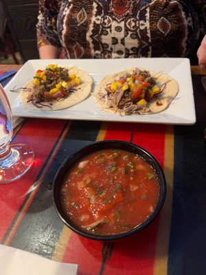 Salsa and pork tacos during happy hour.