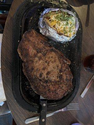 16 oz rib eye black and blue with loaded baked potato