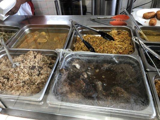 Clockwise from left: curry fish & potato, chow mein, baked chicken, cook-up rice