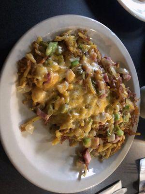 Hash browns with ham, onions, peppers all covered in cheese, so good.