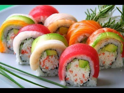 rainbow roll ; Crab, avocado, cucumber with assorted fish on top