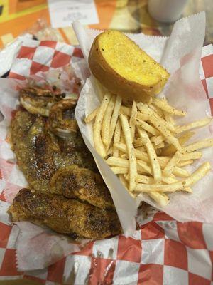 Grilled shrimp, chicken tenders and fish with a side of delicious fries