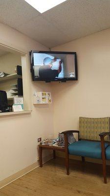 Waiting room has limited sitting, but they do have a TV.