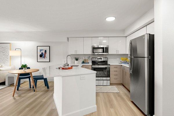 Two-toned white and wood-grain flat front cabinets