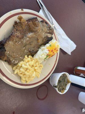 Ribeye Mac and cheese twice baked potato and greens