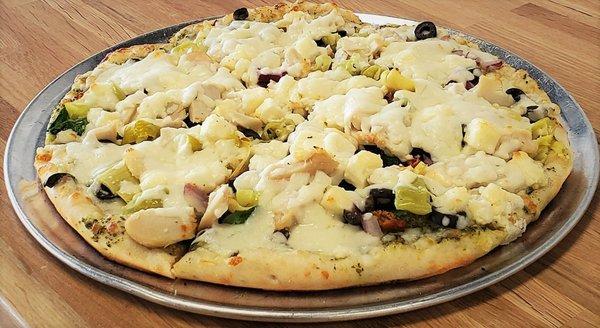 Mediterranean Pizza:Roasted Chicken Pizza, Artichoke, Black Olive, Peppers, Spinach, Red Onion, Sun Dried Tomato, Pesto, Feta, & Mozzarella