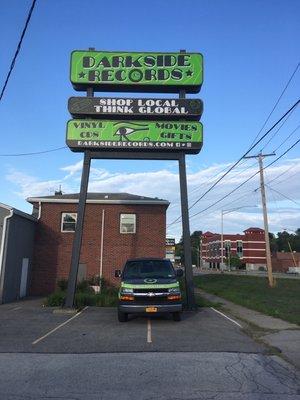 Love that giant sign. There is the van underneath. They pick up big record collections to sell in the store