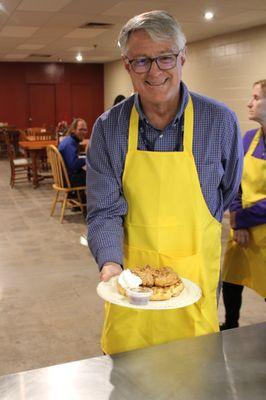 Volunteer ready to serve our guest