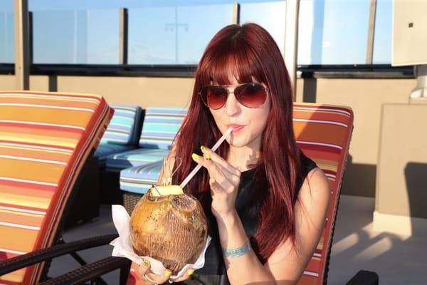 Pinup singer Lisa Marie Smith enjoying one of the roasted coconut drinks I need to try.